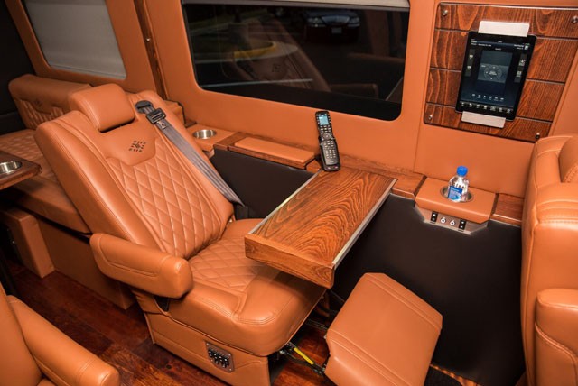 Mercedes Sprinter Ultra Luxury Limo Service Interior Seats and Smart Controller Remote Image