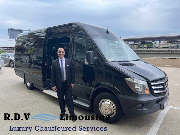 Chauffeur standing beside luxury black limo van at airport curb